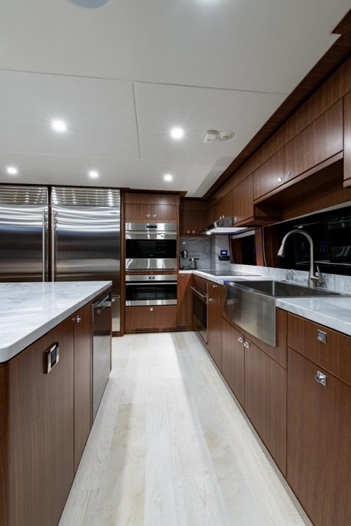 a kitchen with a stainless steel oven aboard GALATI G120 SIGNATURE SERIES Yacht for Sale