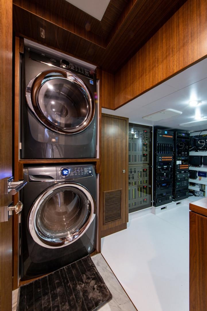 a large washer and dryer in a room aboard GALATI G120 SIGNATURE SERIES Yacht for Sale