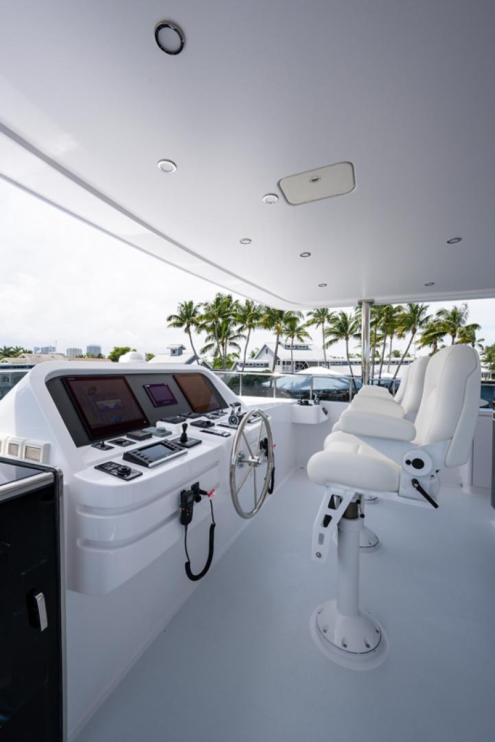 a white car with a screen and a white machine on the side aboard GALATI G120 SIGNATURE SERIES Yacht for Sale