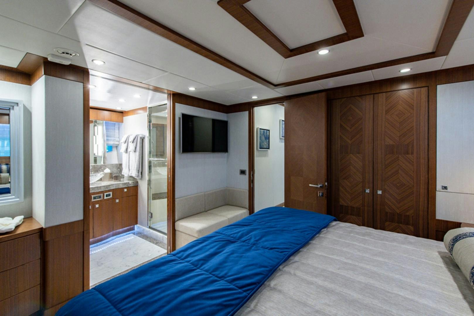 a bedroom with a bed and a closet aboard GALATI G120 SIGNATURE SERIES Yacht for Sale