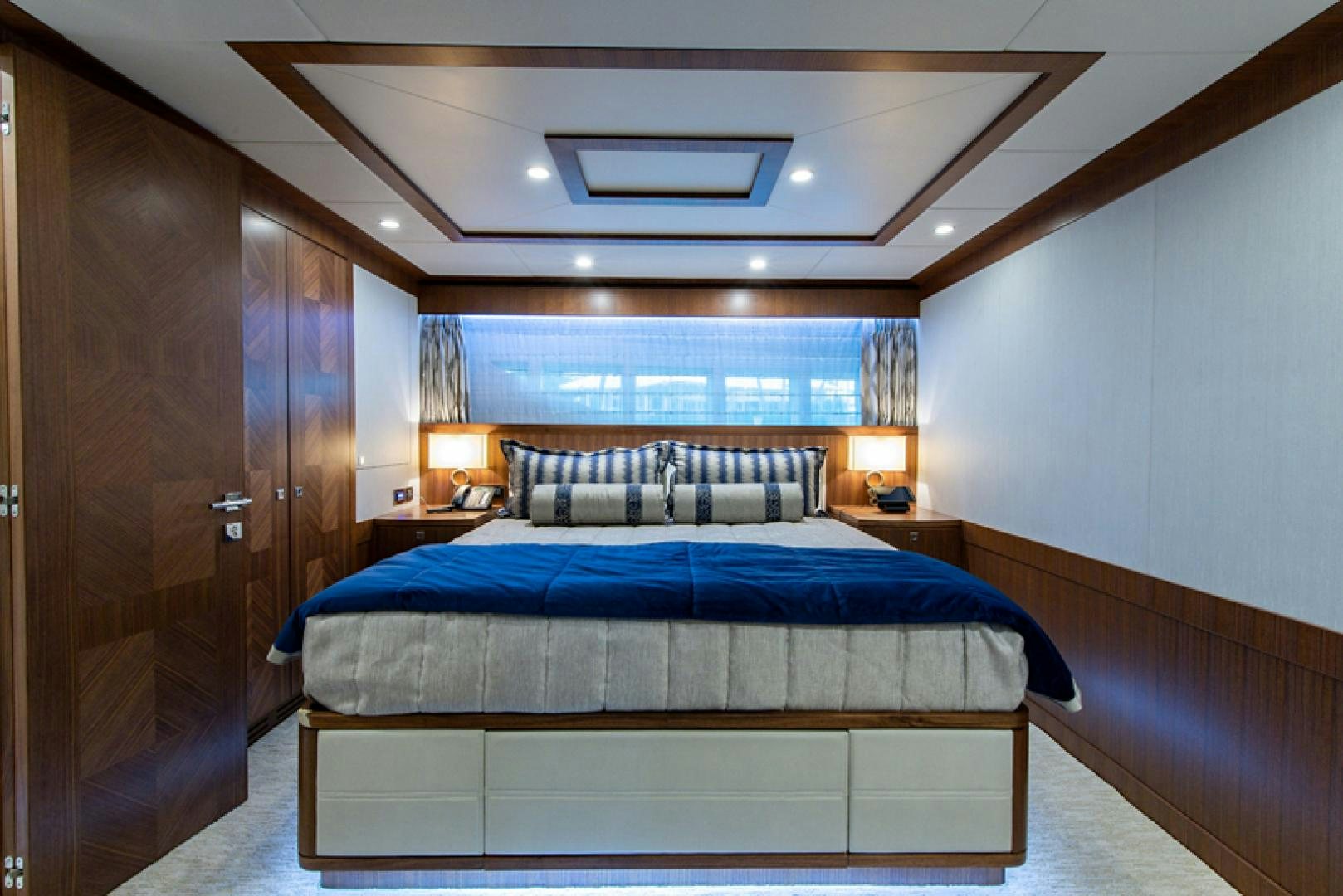 a bedroom with a bed and a desk aboard GALATI G120 SIGNATURE SERIES Yacht for Sale
