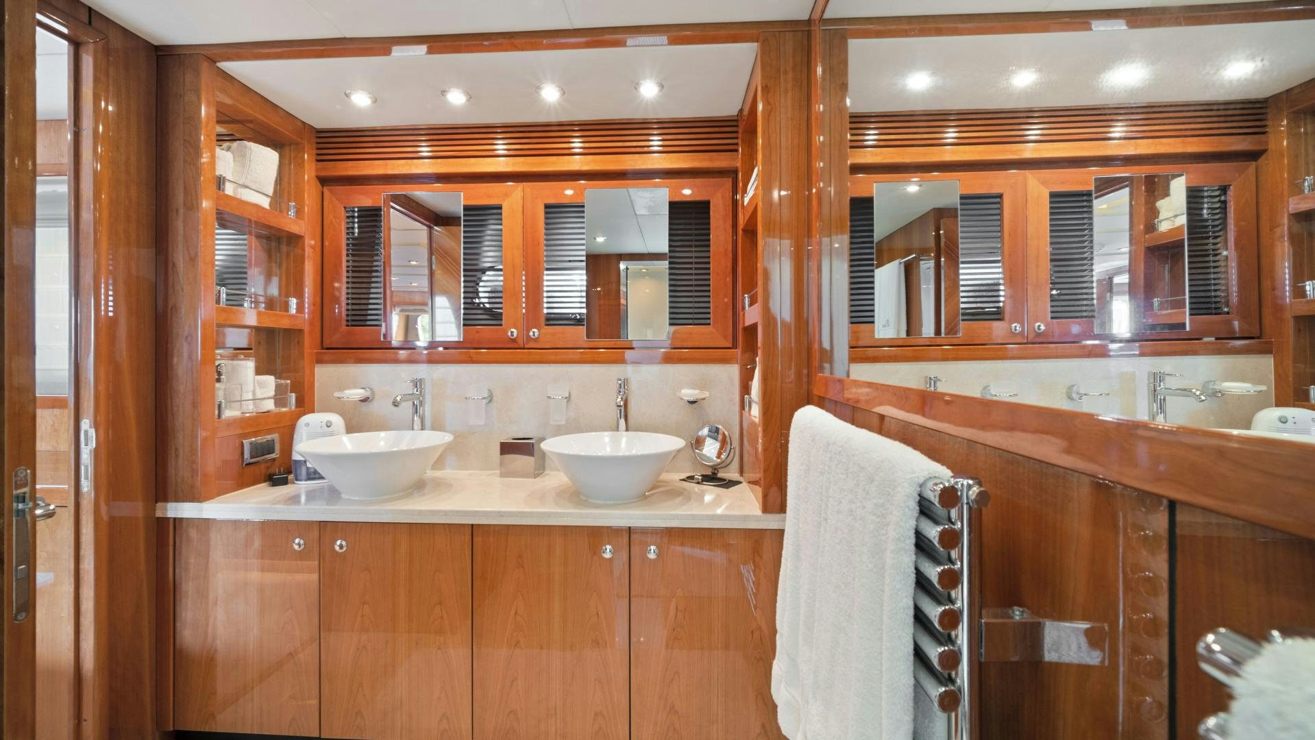 a bathroom with wooden cabinets aboard DIABLO BLANCO Yacht for Sale