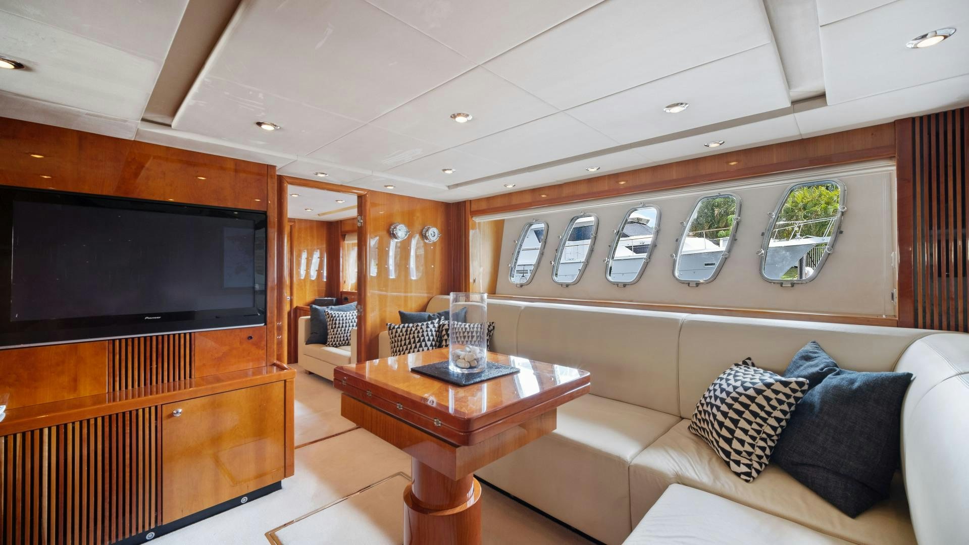 a living room with a couch and a television aboard DIABLO BLANCO Yacht for Sale
