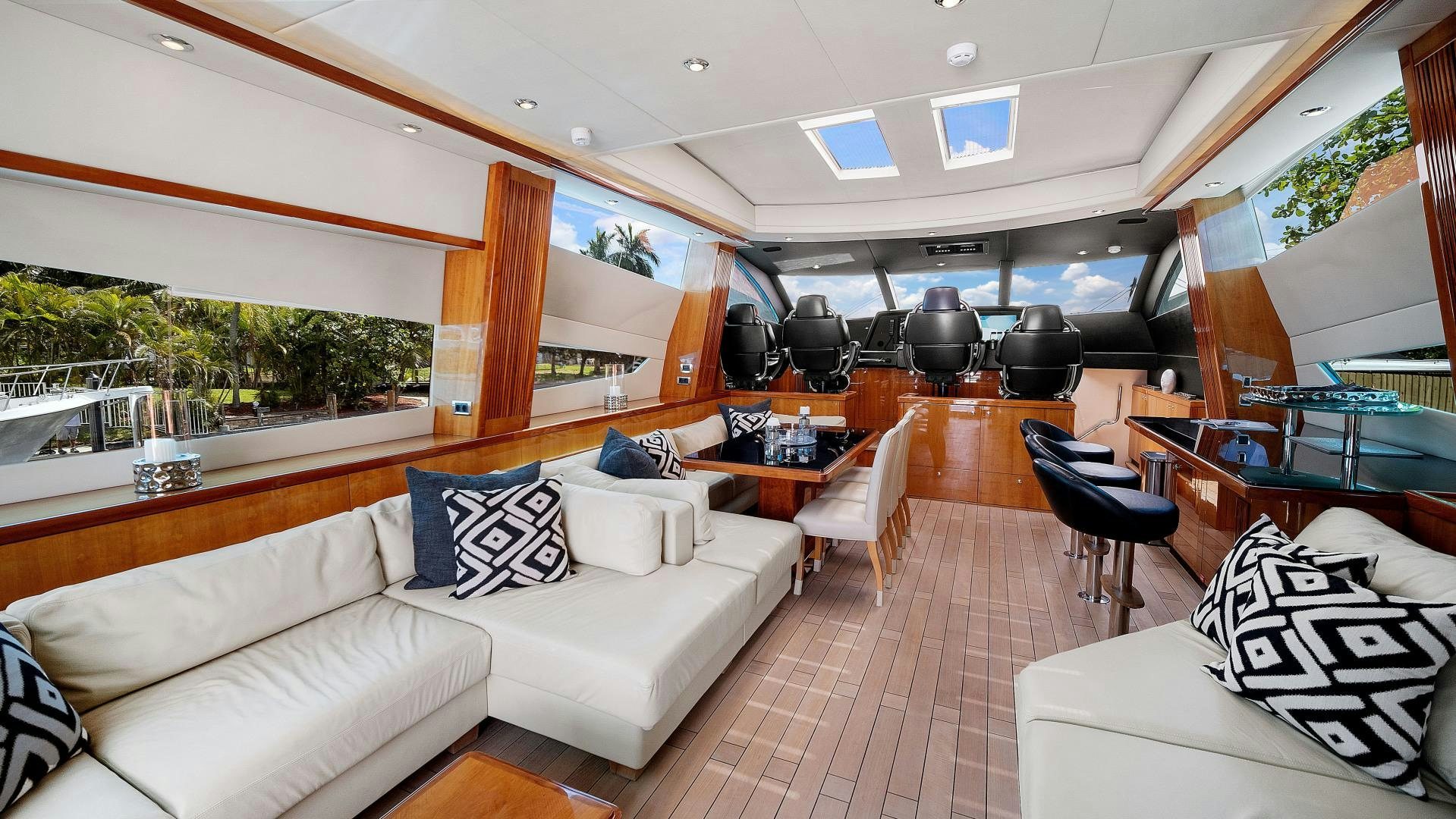 a living room with a couch and a table aboard DIABLO BLANCO Yacht for Sale