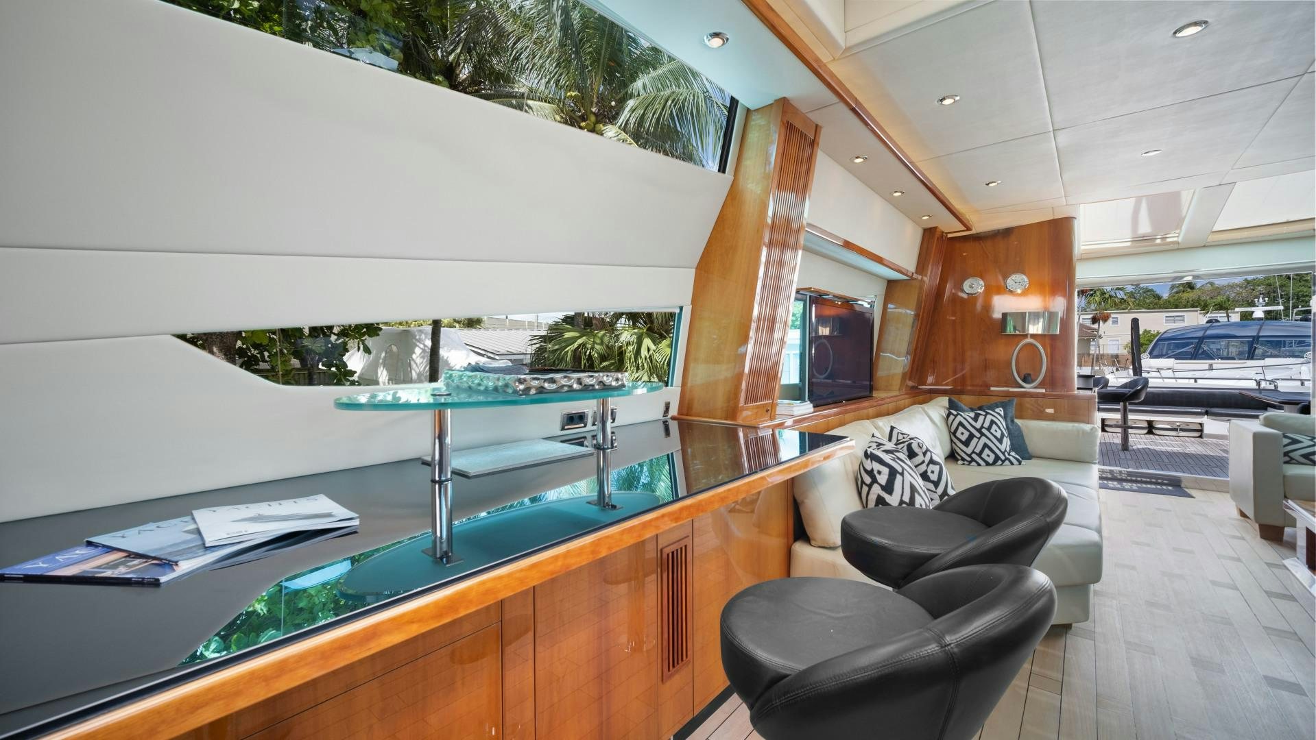 a room with a pool table and chairs aboard DIABLO BLANCO Yacht for Sale