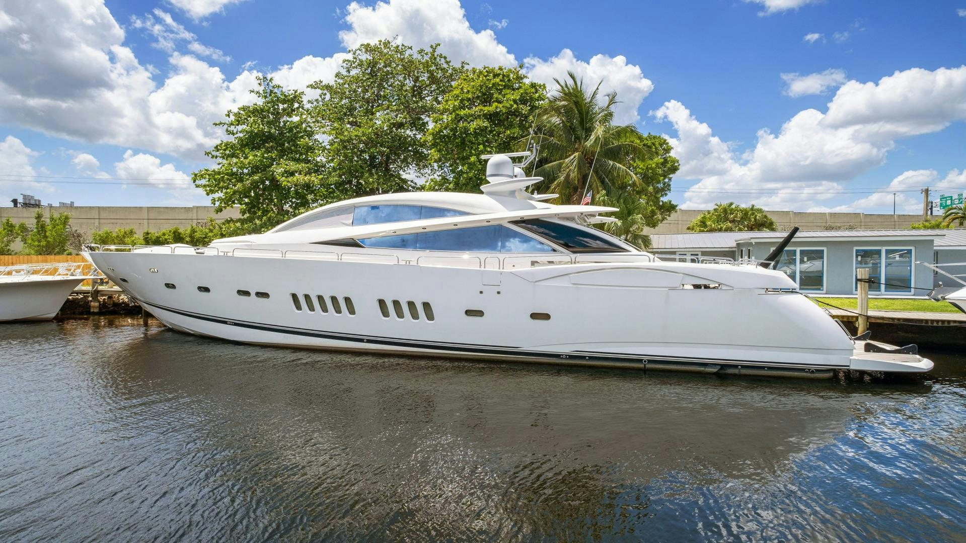 a white yacht docked at a dock aboard DIABLO BLANCO Yacht for Sale