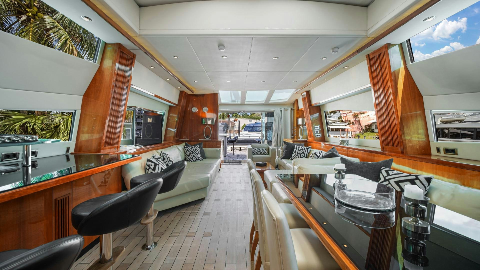 a room with a table chairs and a couch aboard DIABLO BLANCO Yacht for Sale