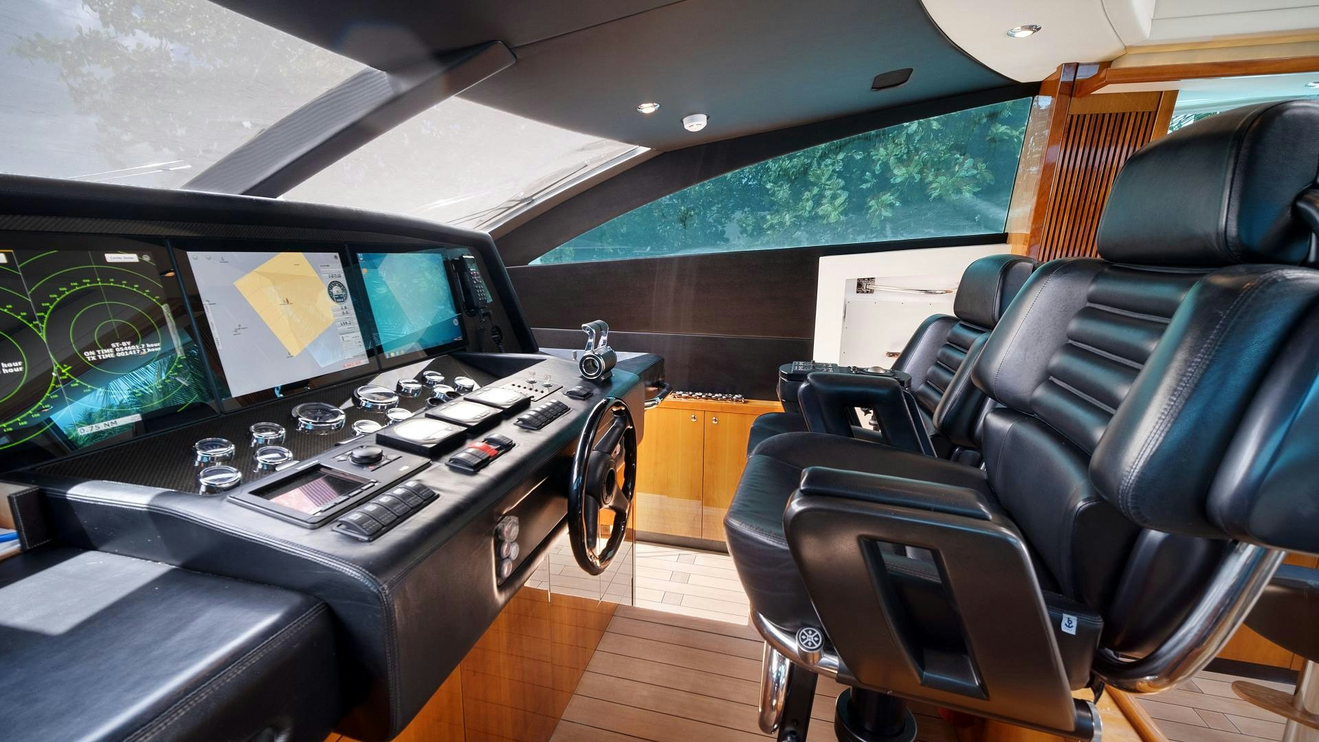 a room with a table and chairs aboard DIABLO BLANCO Yacht for Sale