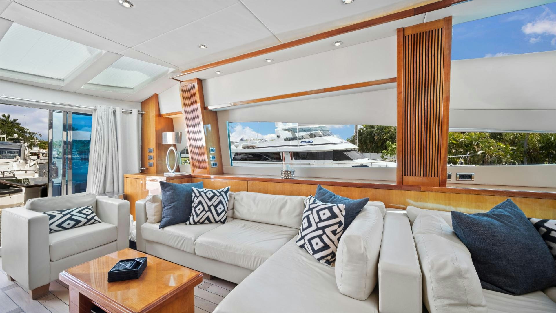 a living room with a large window aboard DIABLO BLANCO Yacht for Sale