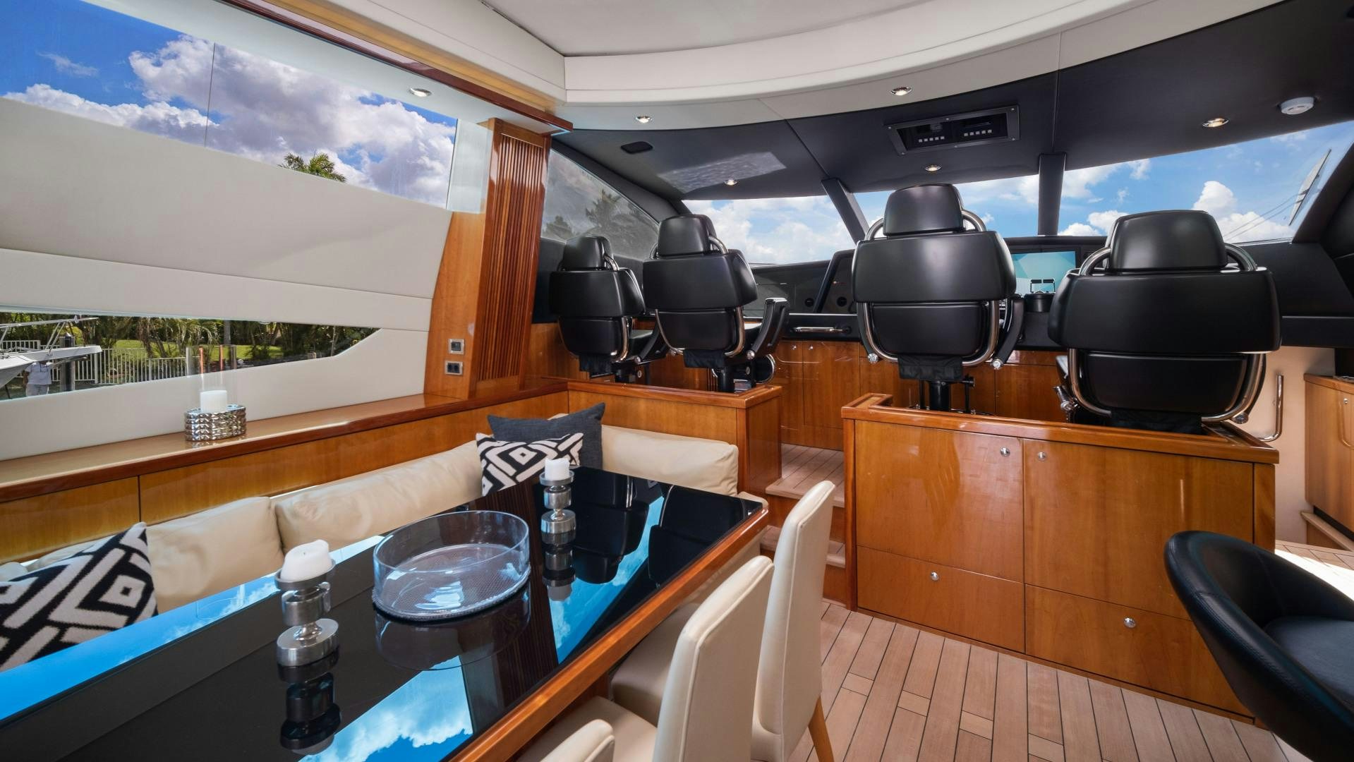 inside of a vehicle with a table and chairs and a large window aboard DIABLO BLANCO Yacht for Sale