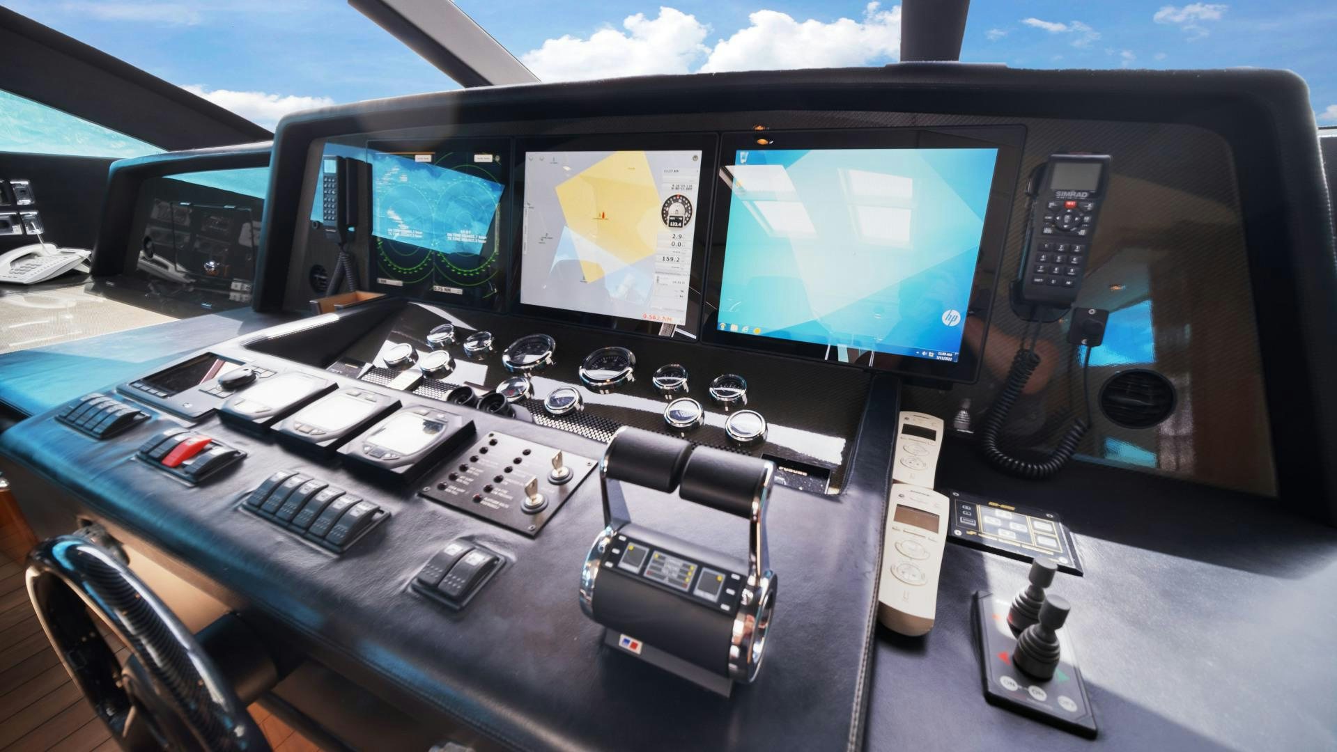 a desk with many computers and electronics on it aboard DIABLO BLANCO Yacht for Sale