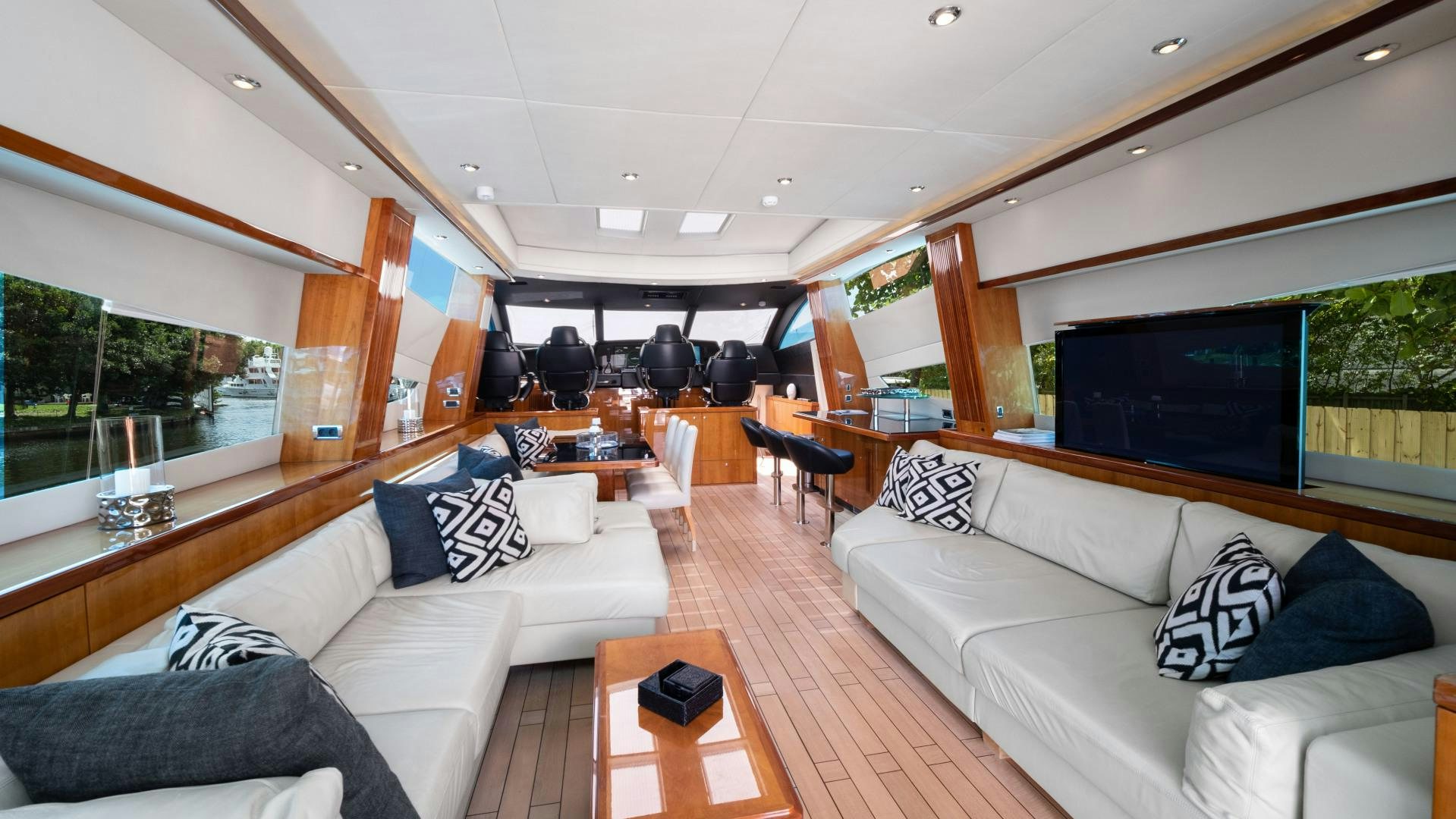 a living room with a couch and a tv aboard DIABLO BLANCO Yacht for Sale