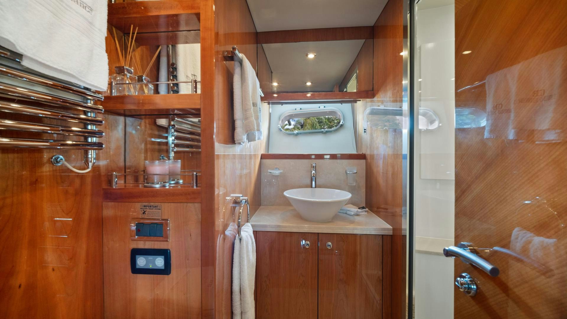 a bathroom with wooden cabinets aboard DIABLO BLANCO Yacht for Sale