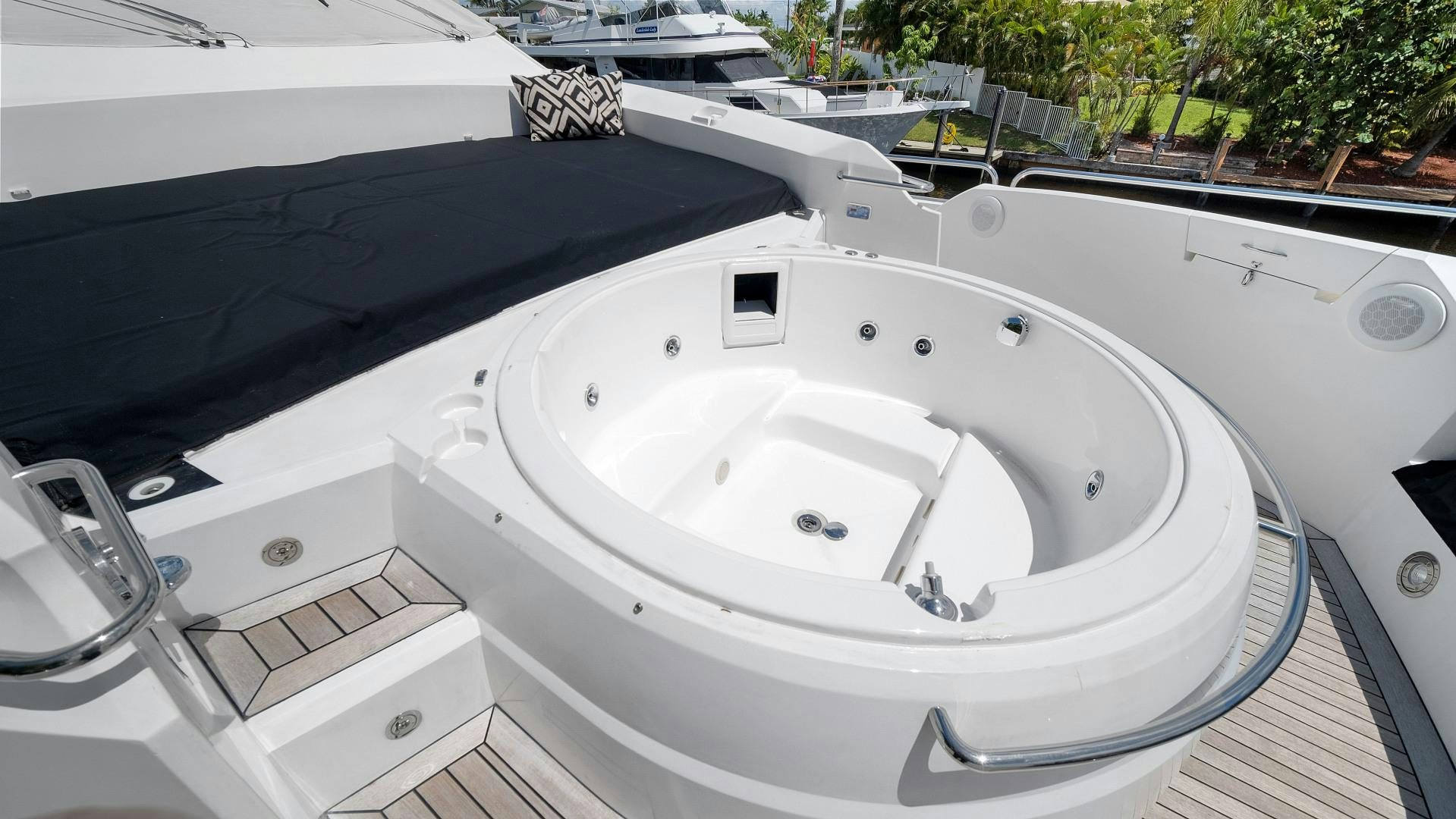 a white sink with a black umbrella aboard DIABLO BLANCO Yacht for Sale
