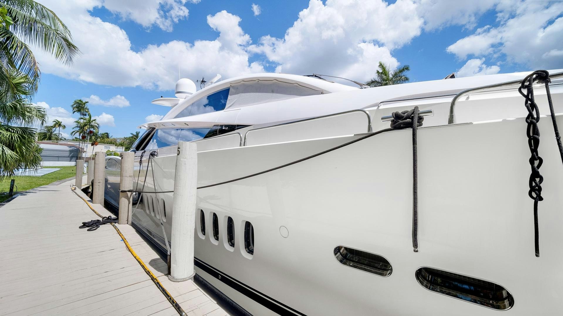 a white yacht on a dock aboard DIABLO BLANCO Yacht for Sale