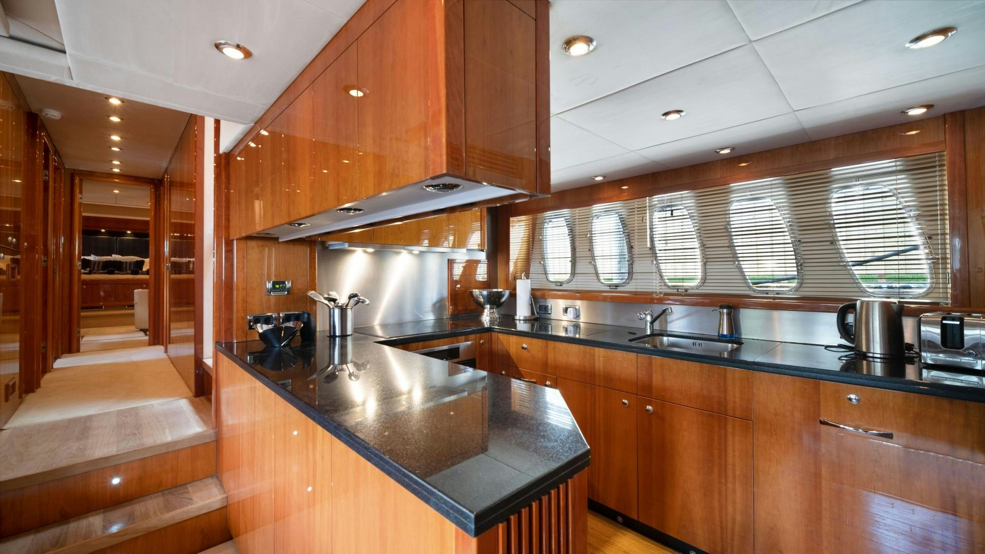a kitchen with a large island aboard DIABLO BLANCO Yacht for Sale
