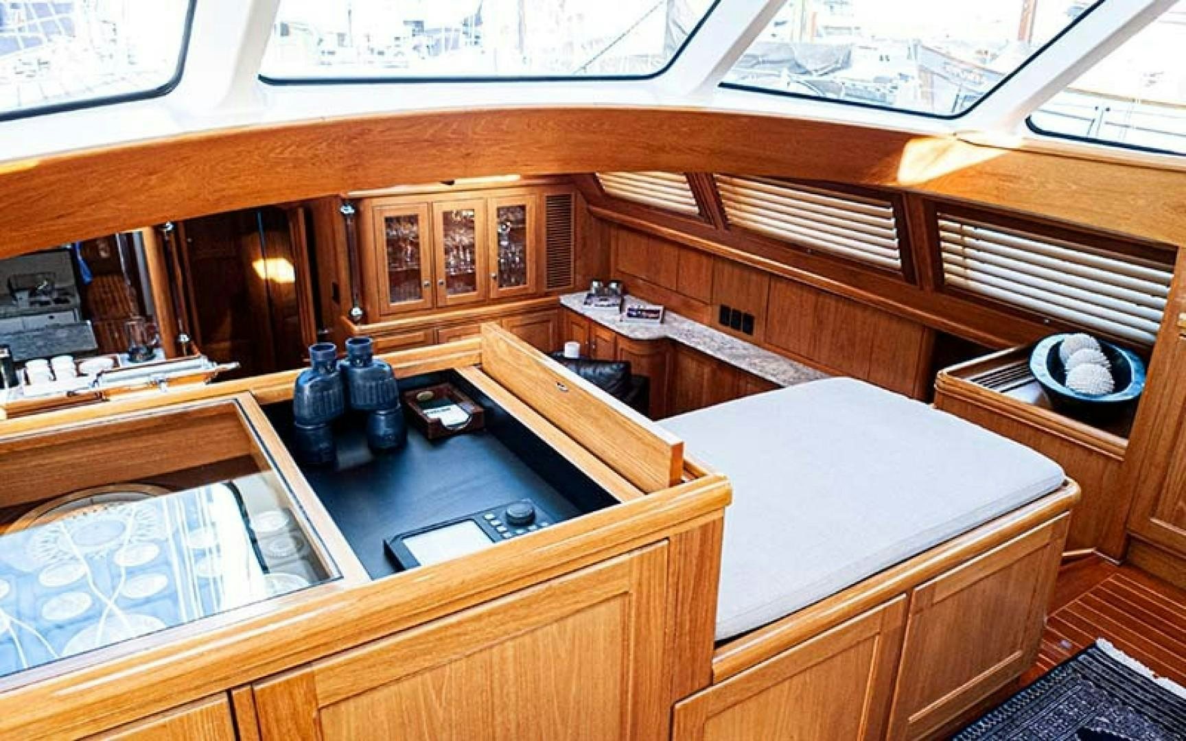 a room with wooden cabinets aboard AVALON Yacht for Sale