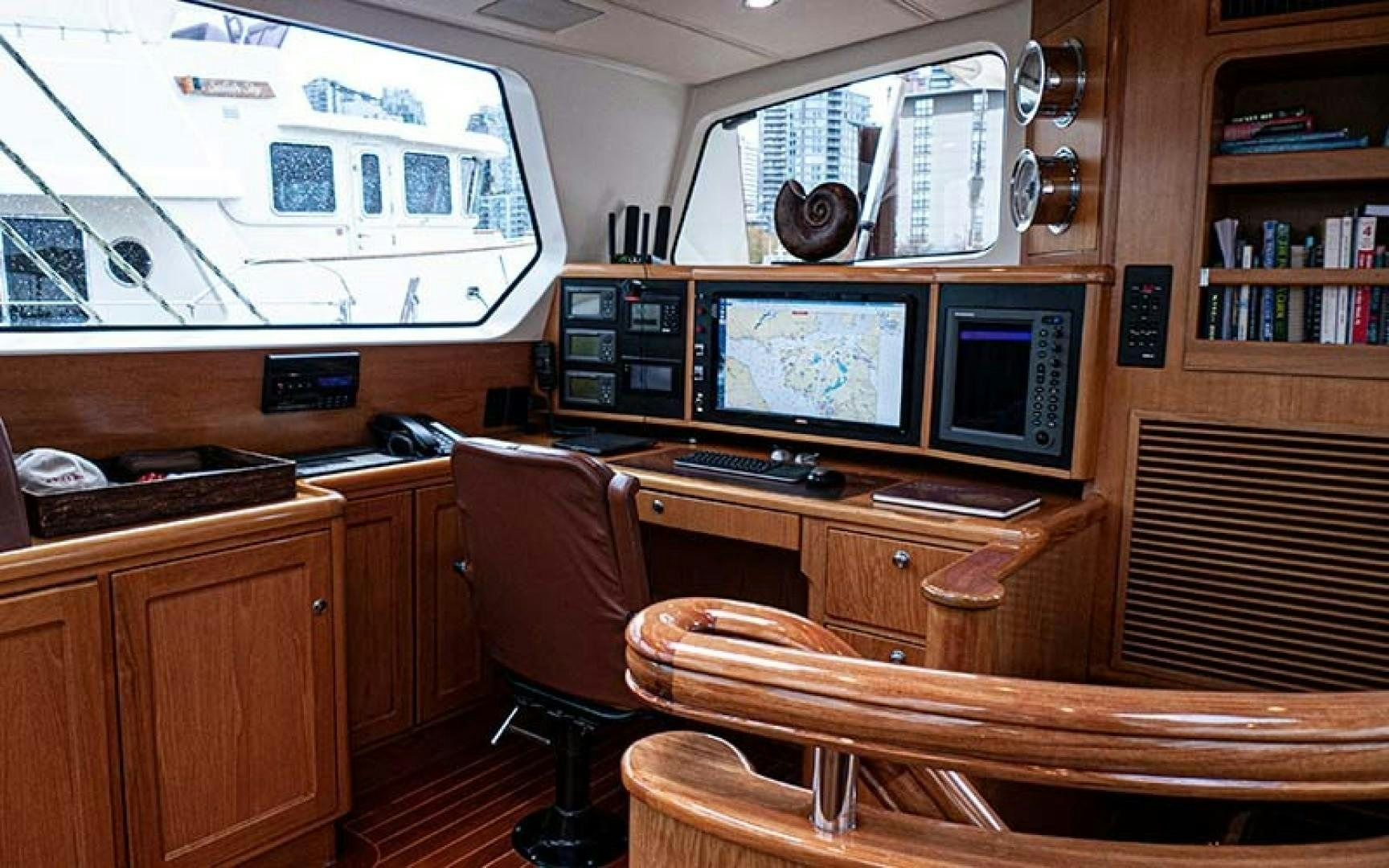 a room with computers and monitors aboard AVALON Yacht for Sale