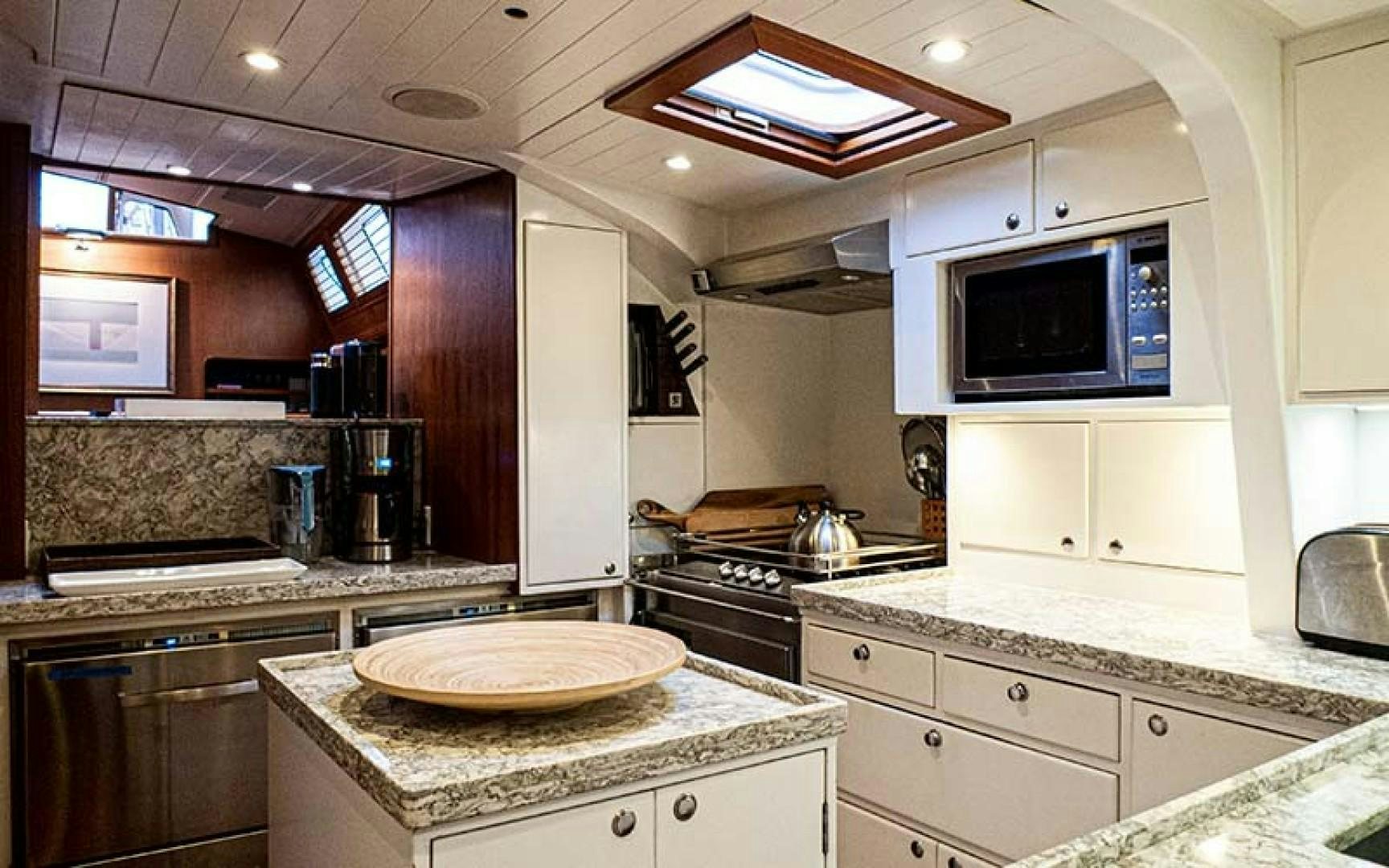 a kitchen with a microwave oven and a microwave aboard AVALON Yacht for Sale