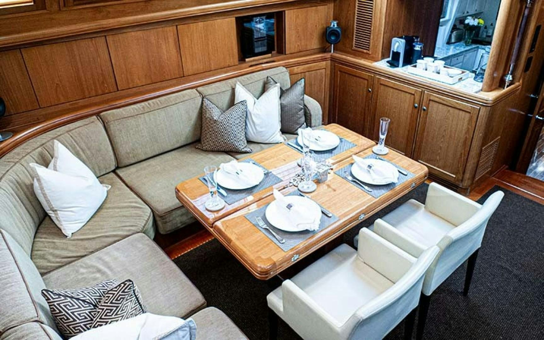 a living room with a couch and a table aboard AVALON Yacht for Sale