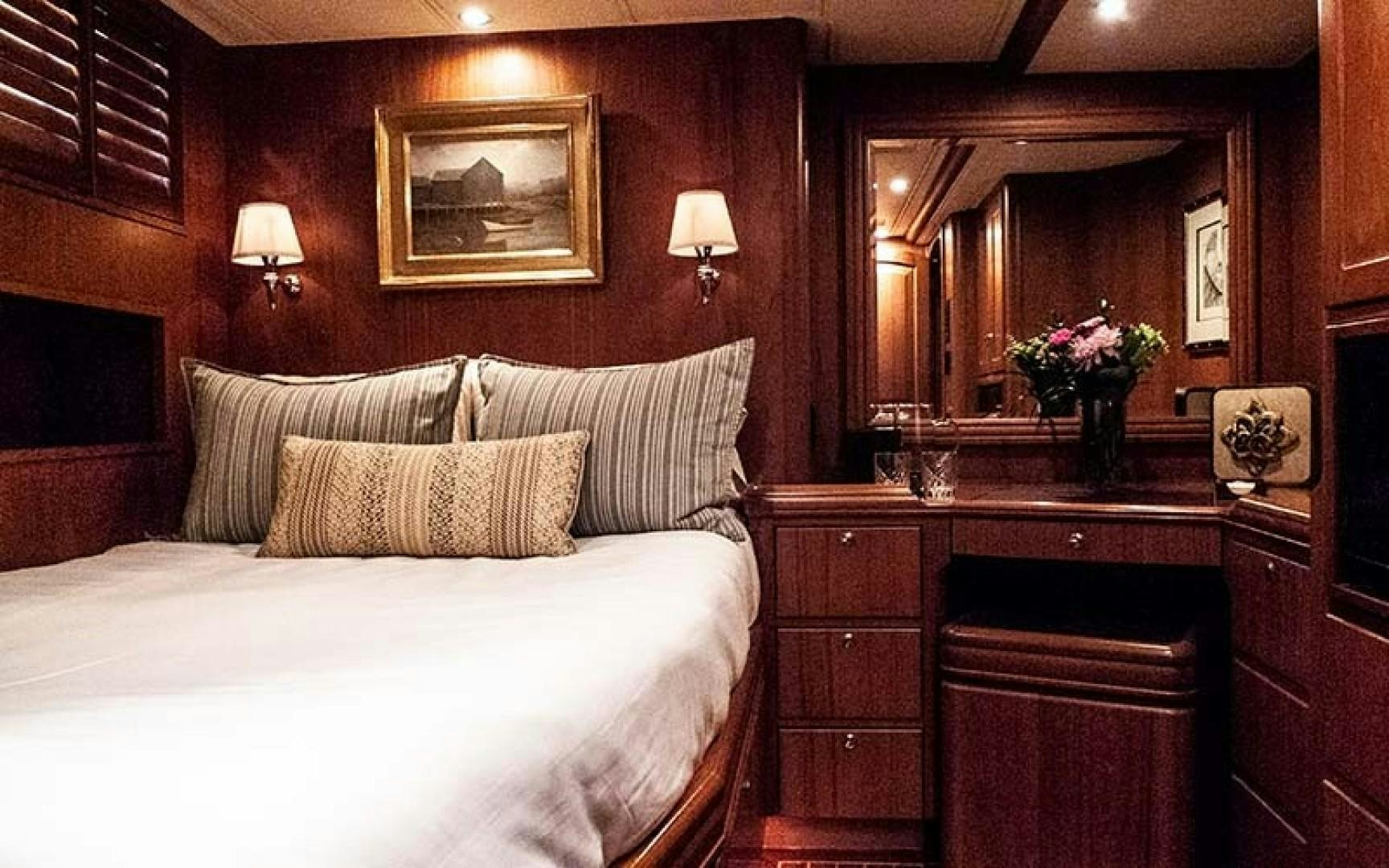 a bed in a room aboard AVALON Yacht for Sale