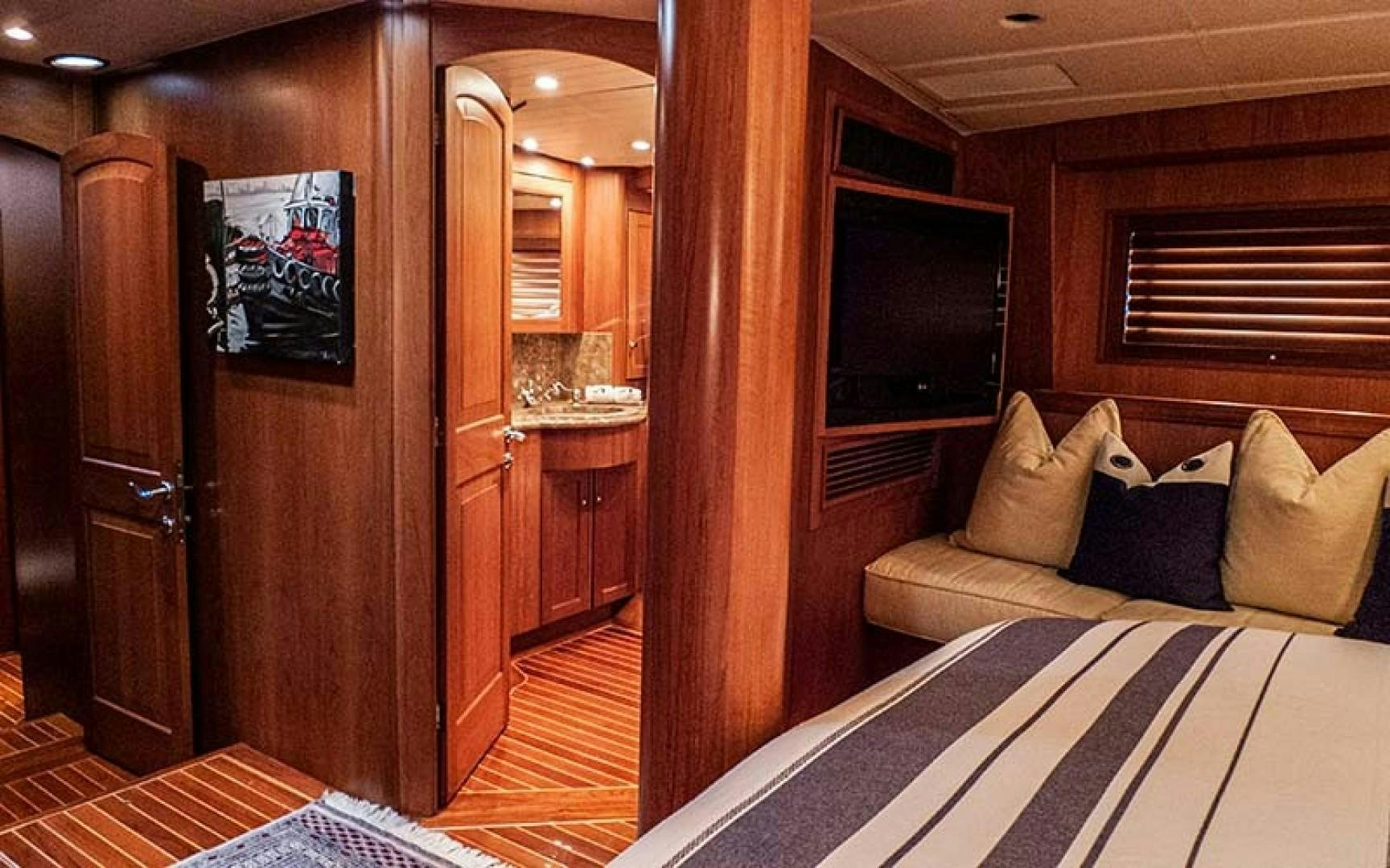 a room with a bed and a television aboard AVALON Yacht for Sale