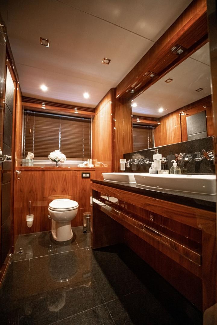 a bathroom with a large mirror aboard LE SORELLE III Yacht for Sale