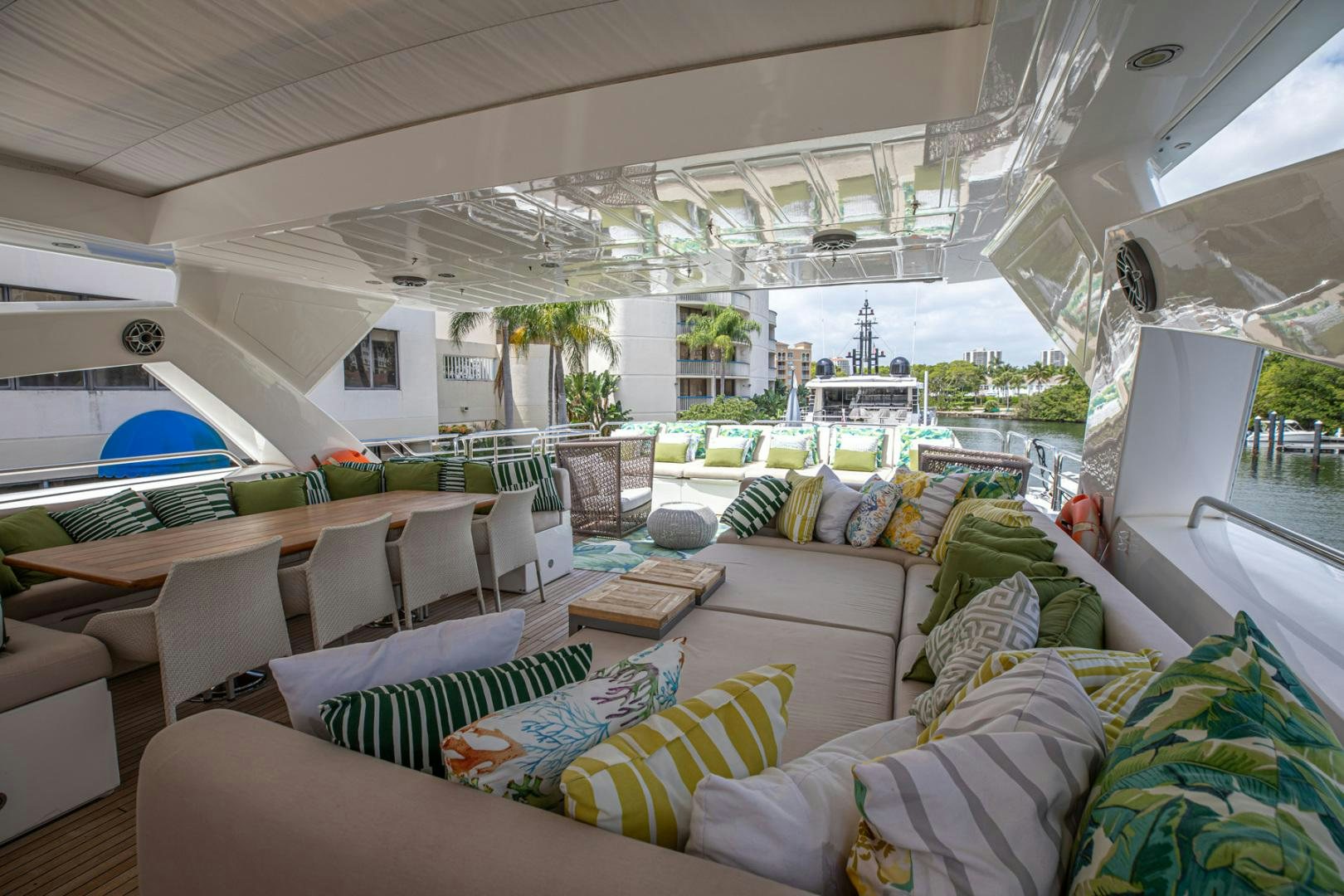a room with a couch and a table and chairs aboard LE SORELLE III Yacht for Sale