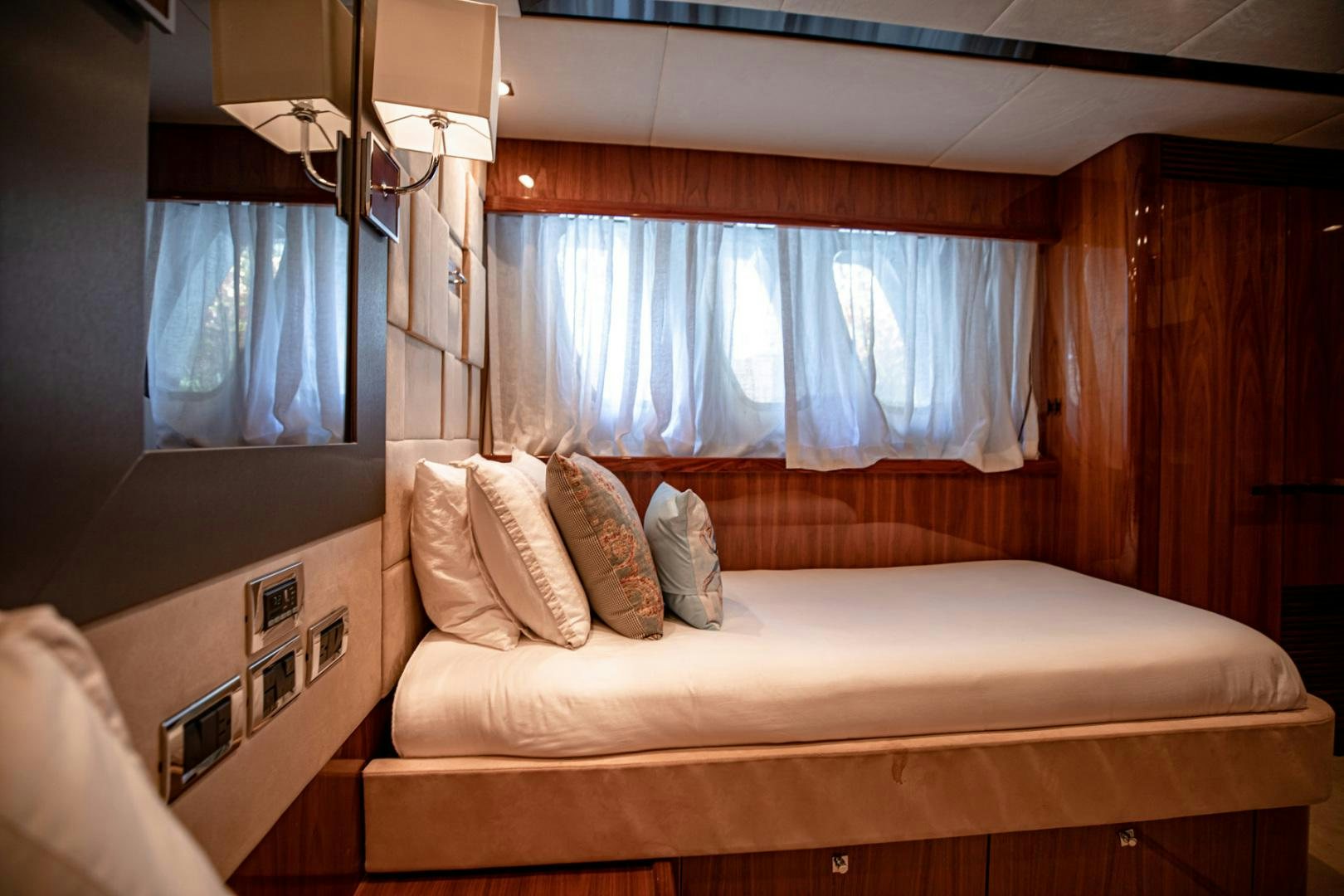 a bed with pillows aboard LE SORELLE III Yacht for Sale