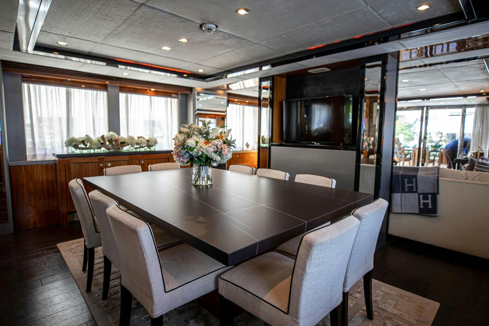 a large kitchen with a table and chairs aboard LE SORELLE III Yacht for Sale