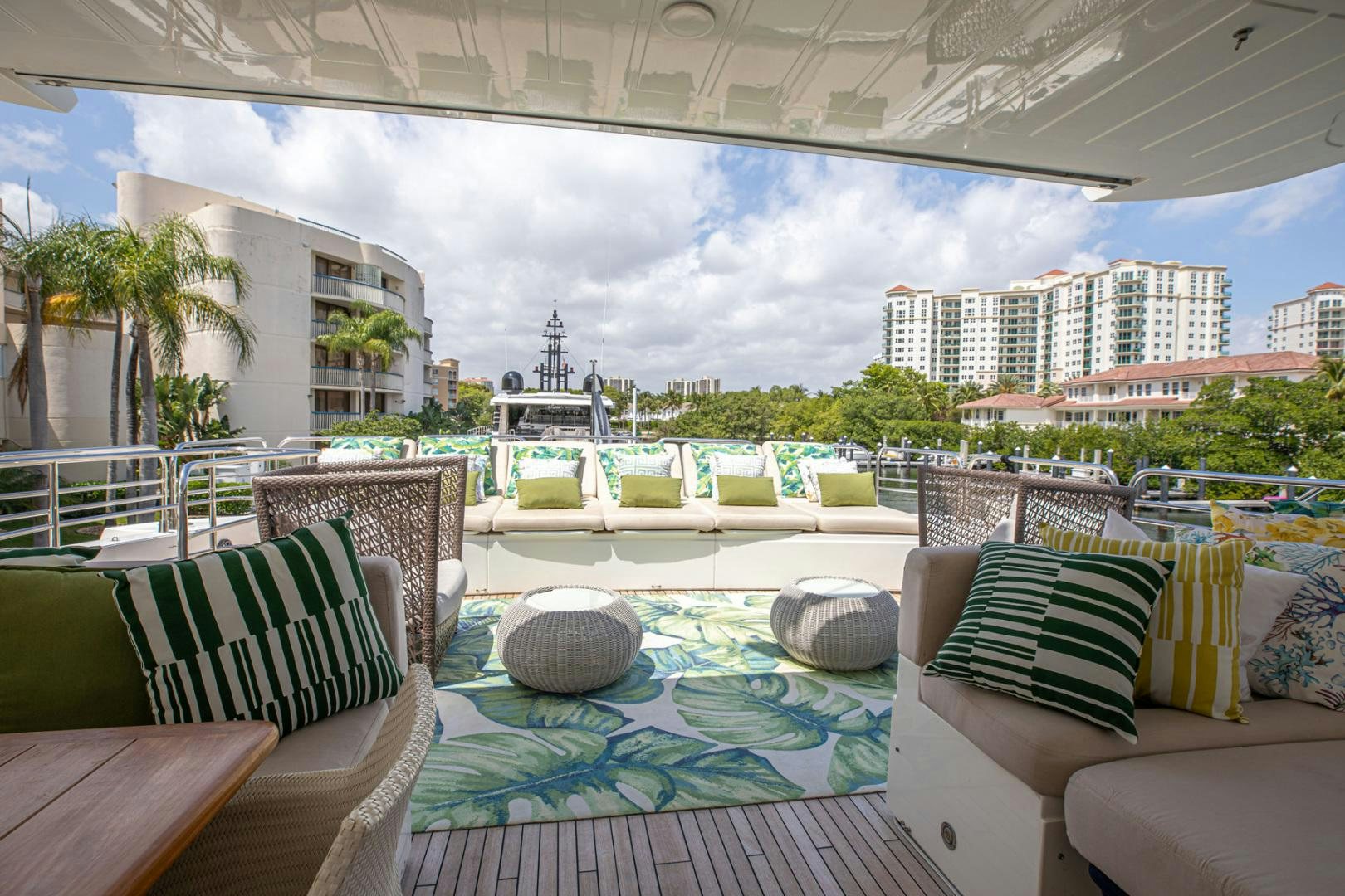 a patio with a table and chairs aboard LE SORELLE III Yacht for Sale