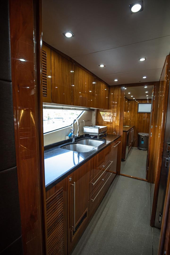 a kitchen with a sink and cabinets aboard LE SORELLE III Yacht for Sale