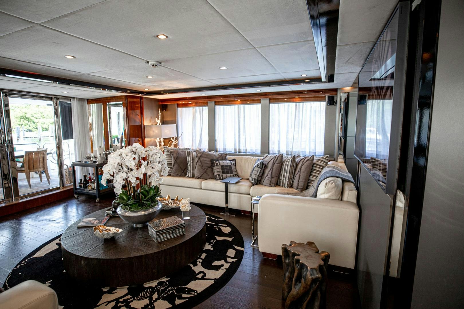 a living room with a large window aboard LE SORELLE III Yacht for Sale