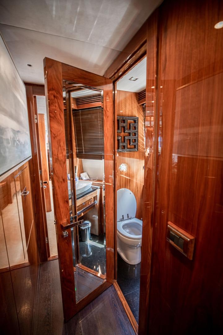 a bathroom with a toilet and a sink aboard LE SORELLE III Yacht for Sale