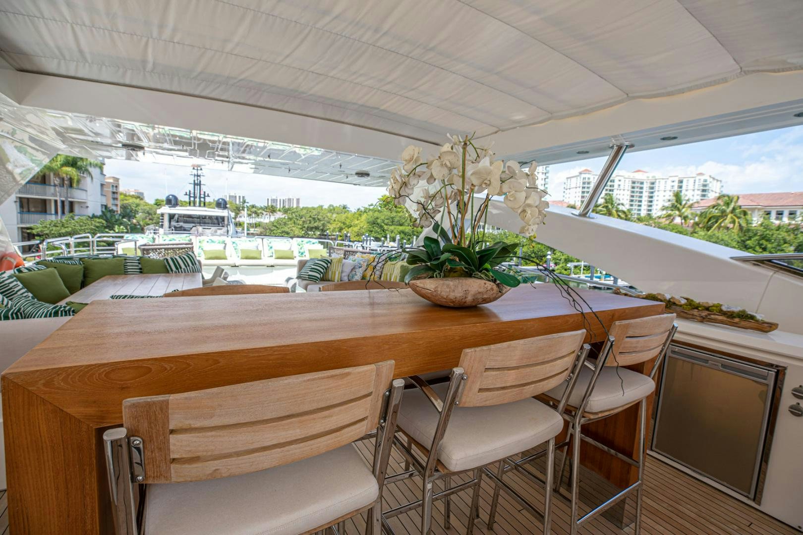 a table with chairs around it aboard LE SORELLE III Yacht for Sale