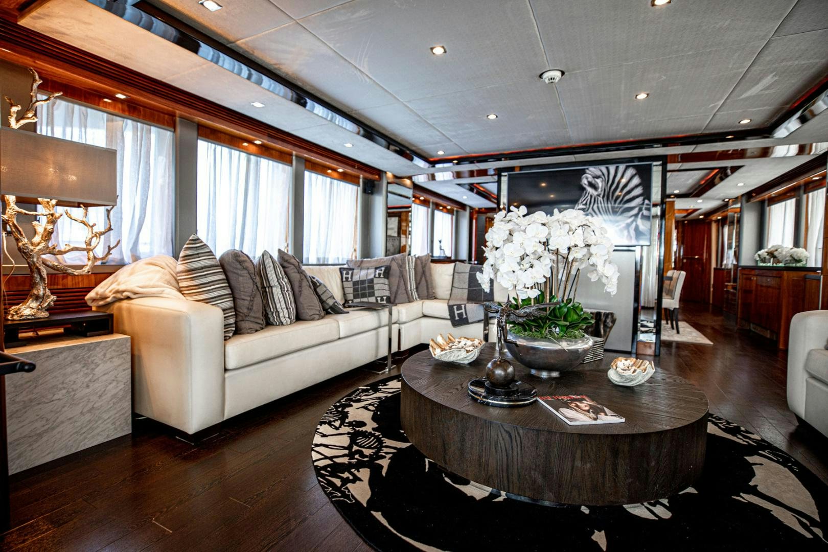 a living room with a large window aboard LE SORELLE III Yacht for Sale