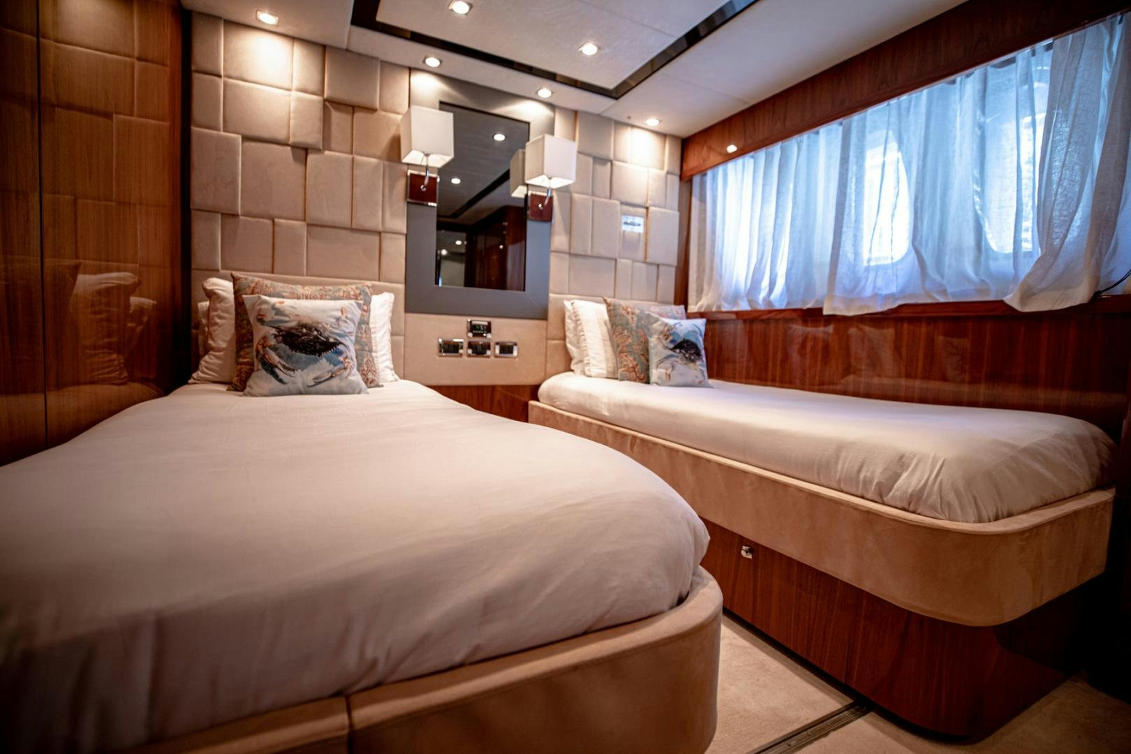 a couple of beds in a hotel room aboard LE SORELLE III Yacht for Sale