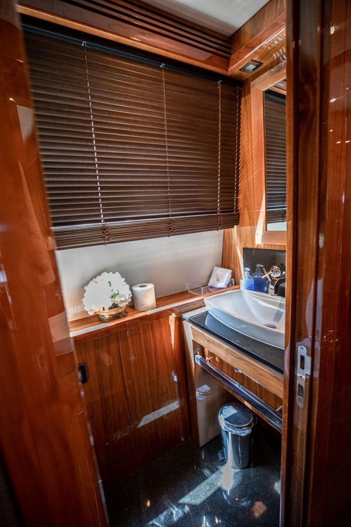 a bathroom with a sink and a bathtub aboard LE SORELLE III Yacht for Sale