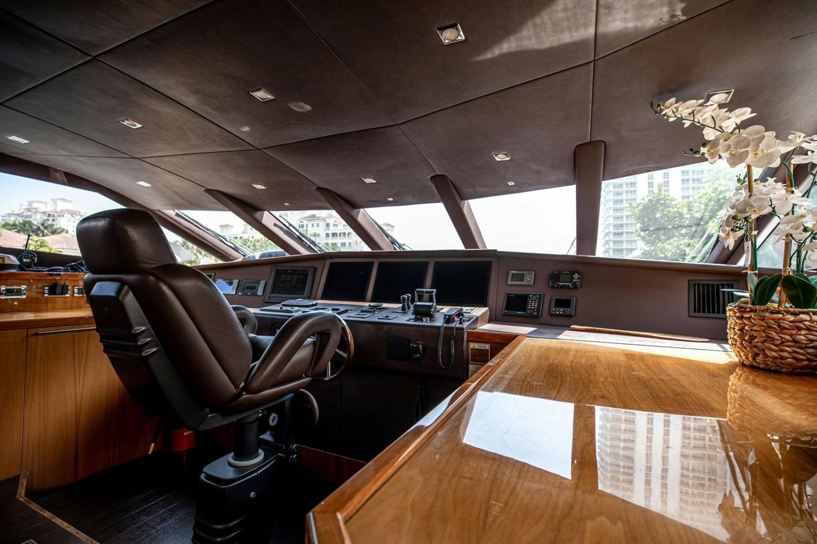 a room with a table and chairs aboard LE SORELLE III Yacht for Sale