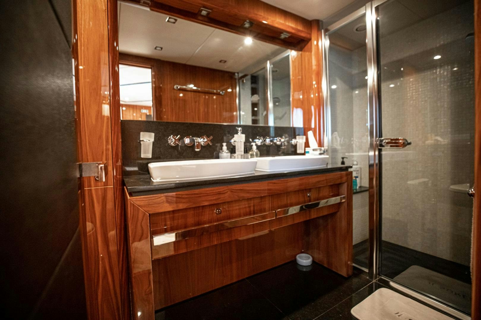 a bathroom with a large mirror aboard LE SORELLE III Yacht for Sale