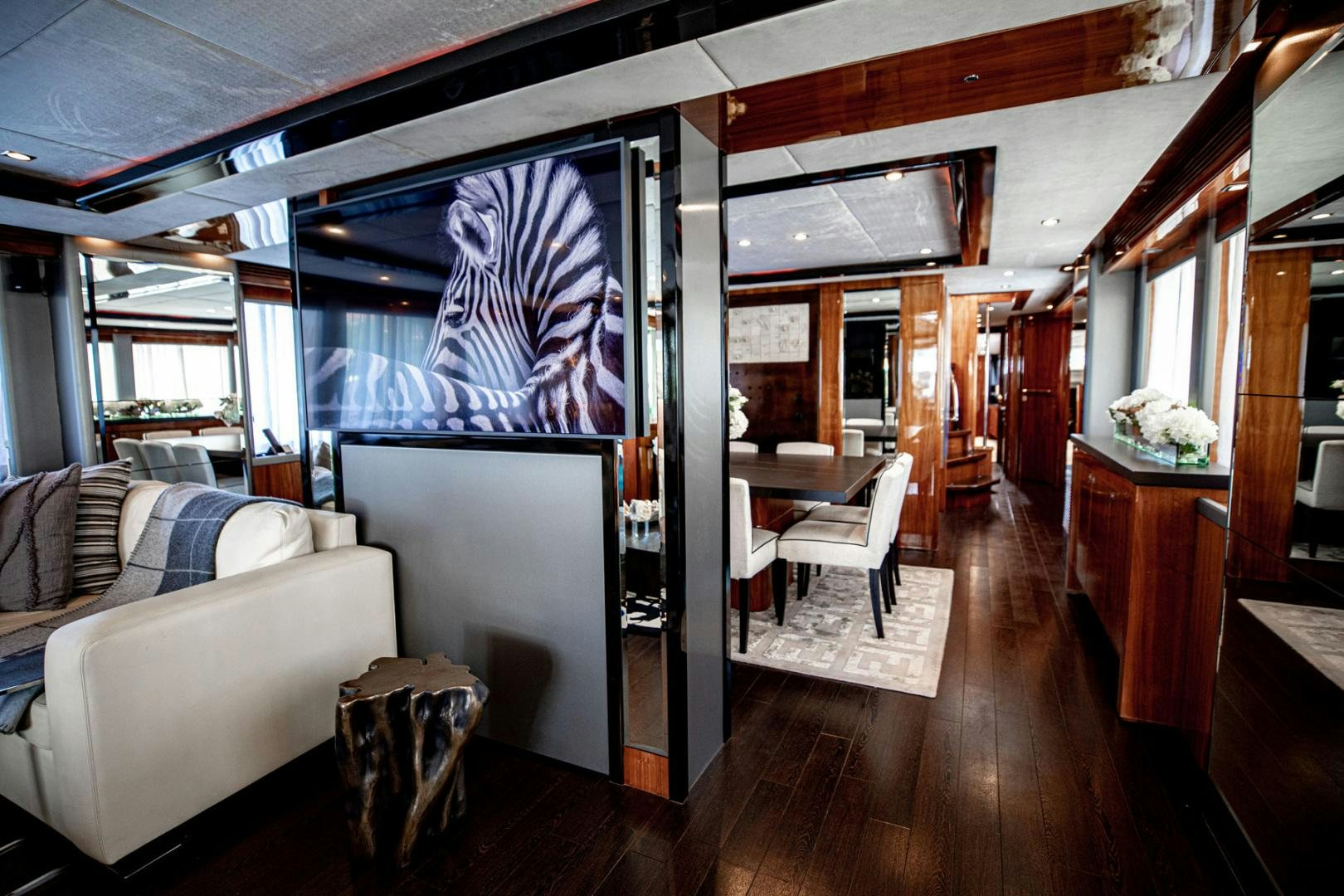 a living room with a large window aboard LE SORELLE III Yacht for Sale