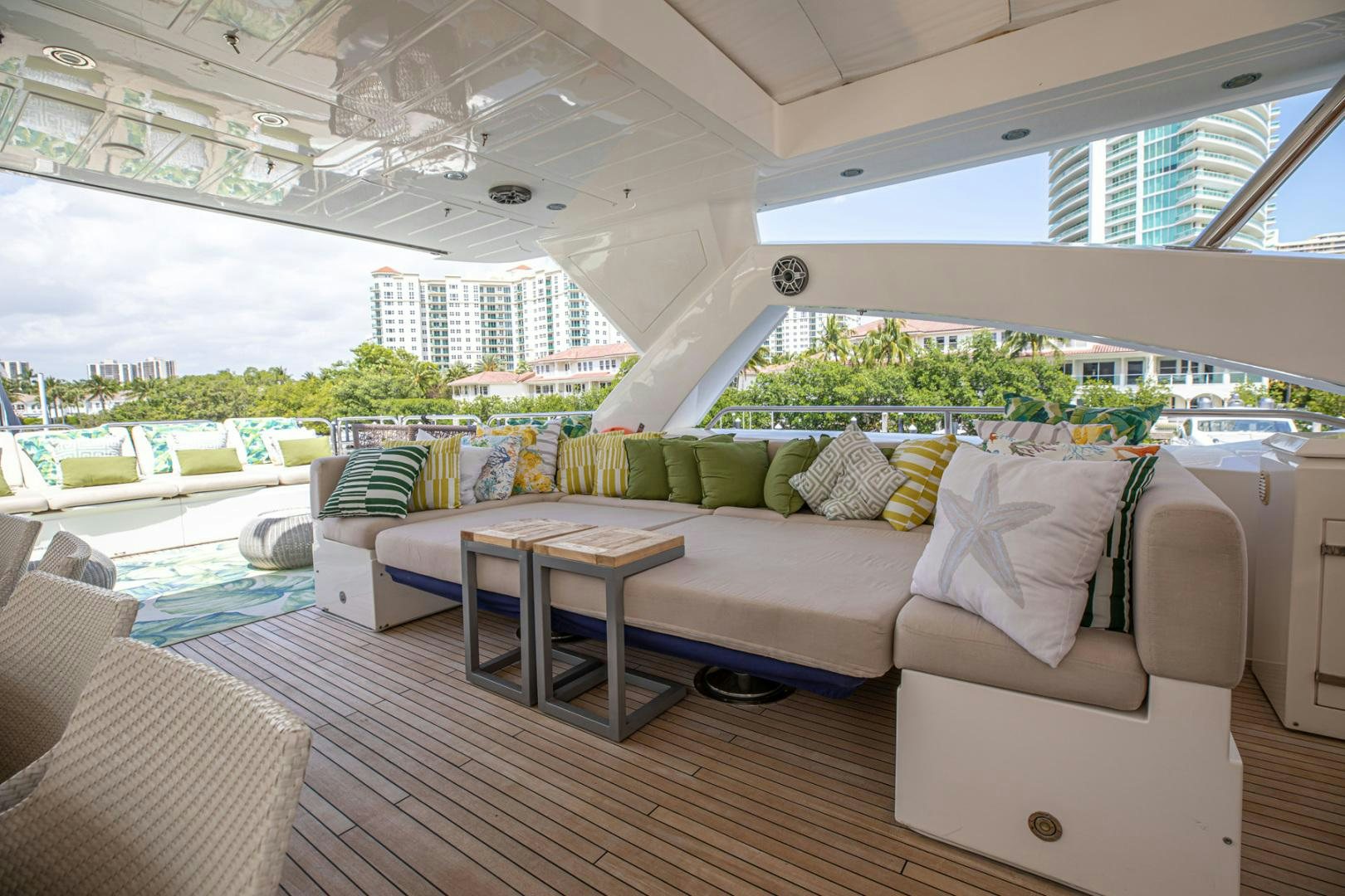 a living room with a couch and a table aboard LE SORELLE III Yacht for Sale