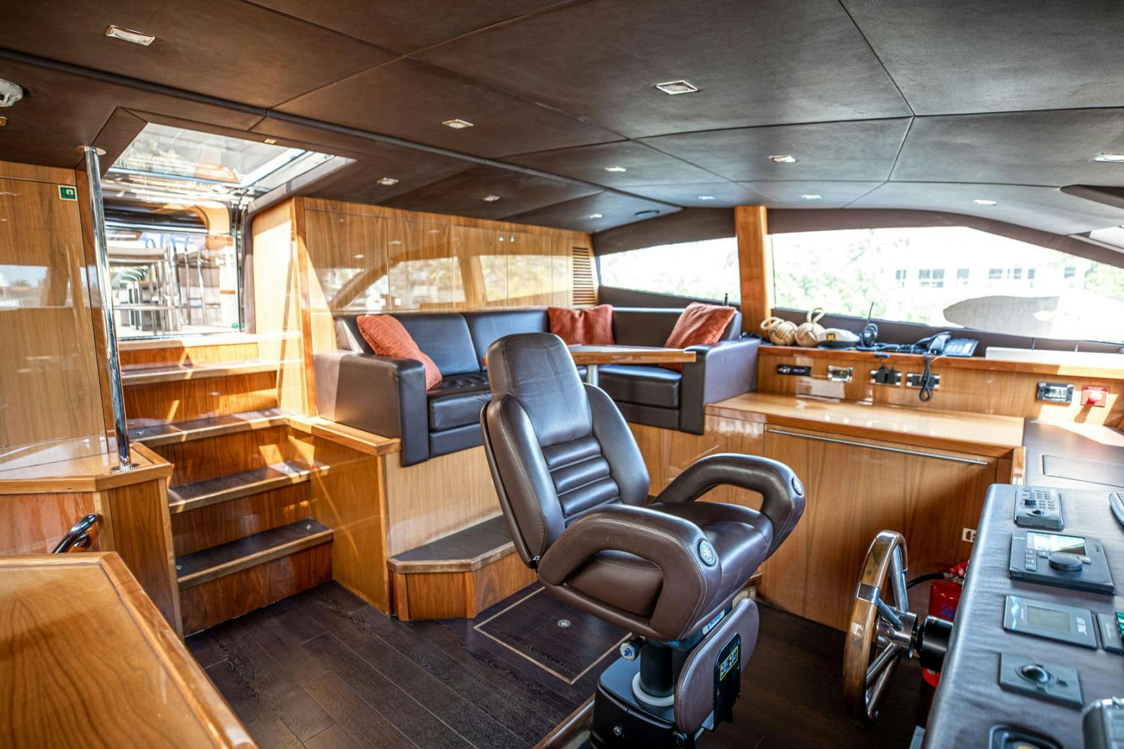 a room with a leather chair and a desk aboard LE SORELLE III Yacht for Sale