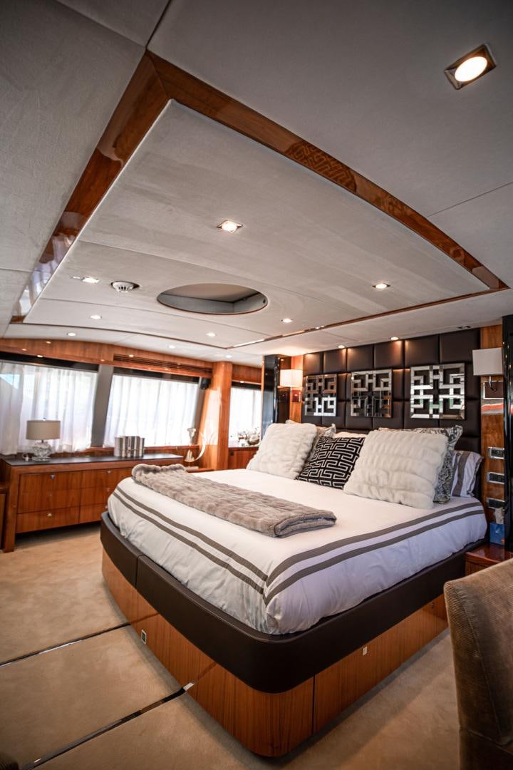 a large bed in a room aboard LE SORELLE III Yacht for Sale