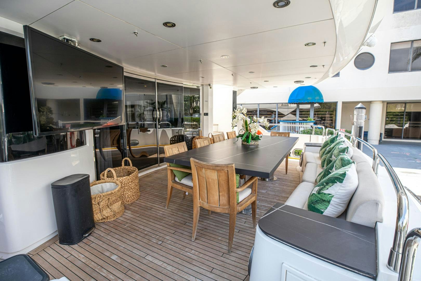 a living room with a table and chairs aboard LE SORELLE III Yacht for Sale