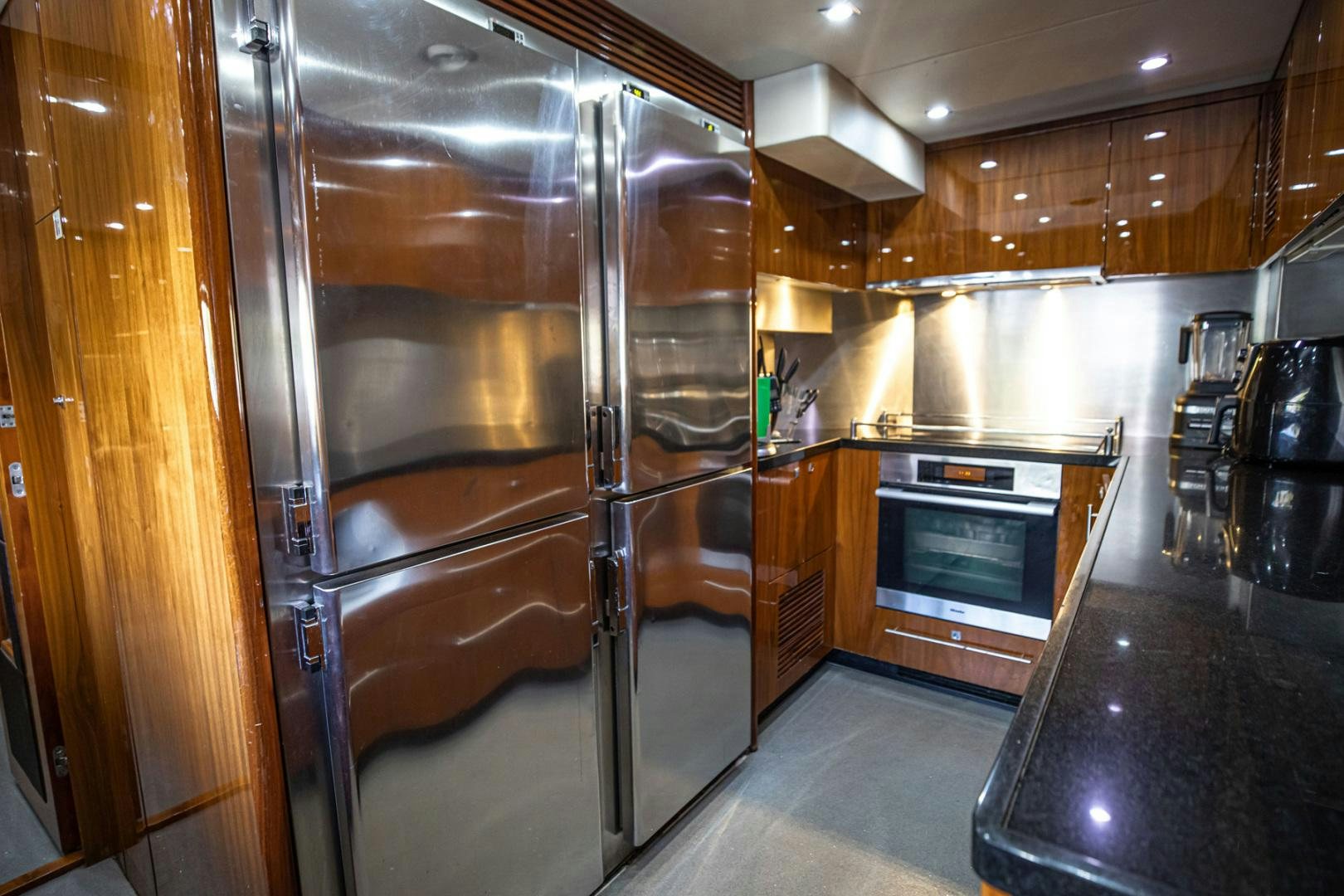 a kitchen with stainless steel appliances aboard LE SORELLE III Yacht for Sale