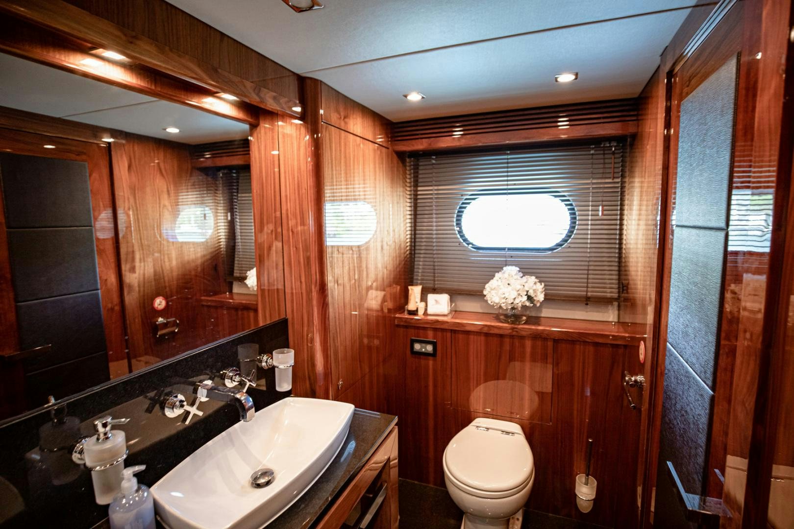 a bathroom with a sink toilet and a bathtub aboard LE SORELLE III Yacht for Sale