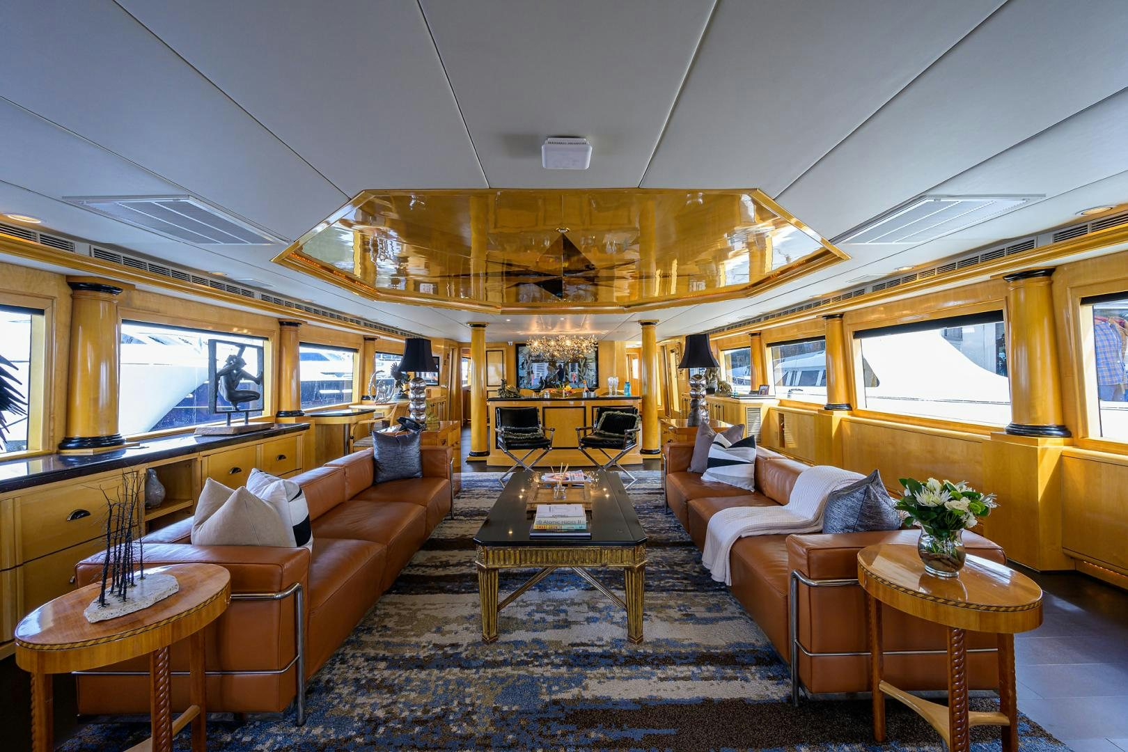 a living room with a couch and a table aboard MEMORYMAKER Yacht for Sale