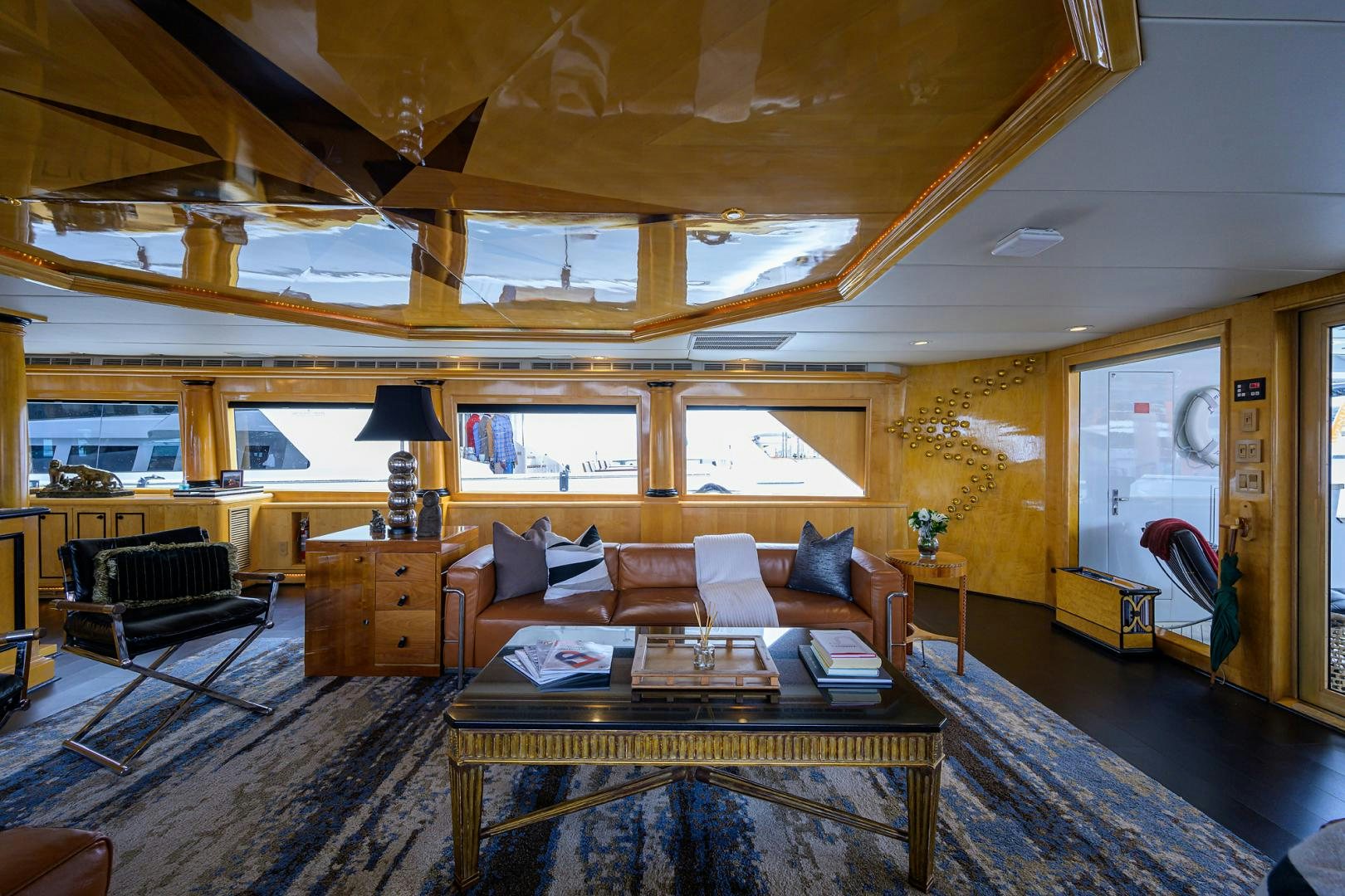 a living room with a large wood ceiling aboard MEMORYMAKER Yacht for Sale