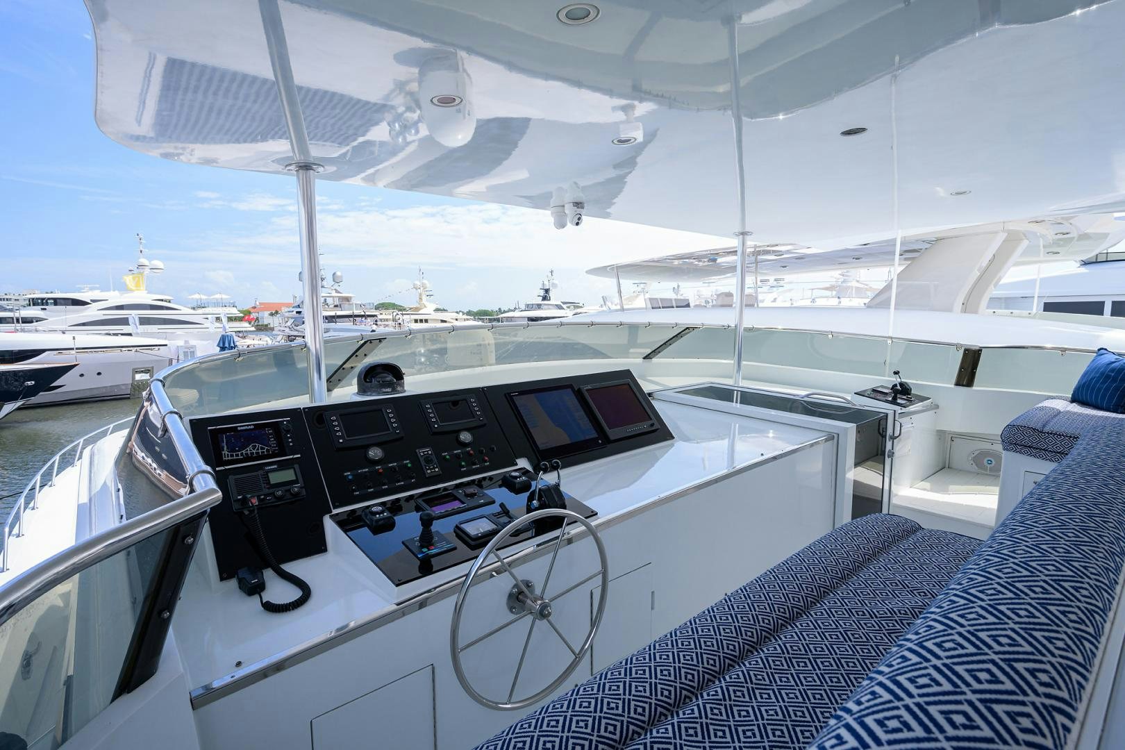 a boat with a table and chairs aboard MEMORYMAKER Yacht for Sale